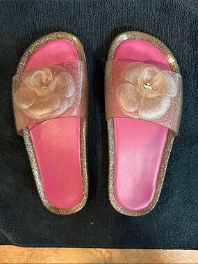 Pink Kate Spade Glitter Floral Slide Sandals.